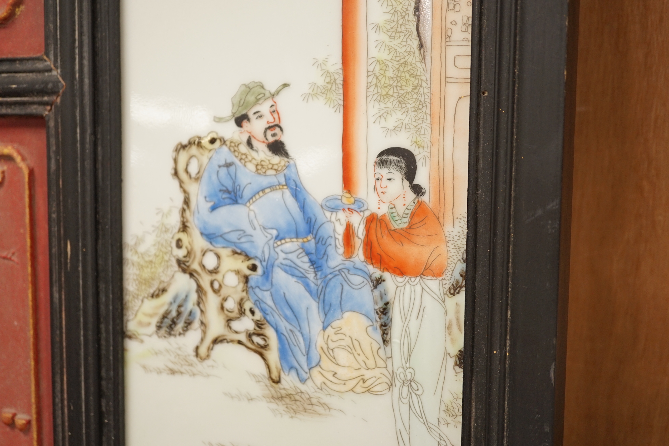 A 20th century Chinese screen with an inset porcelain plaque, 81x39cm